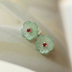 💚💚 Specifics: Materials: A natural Jade stud petal earring with a 2mm diameter ruby set in the middle, 925 silver. The jade earrings are natural vivid green color. Diameter of the Jade Stud Earings: 10mm Thickness of the Jade Stud Earrings：2.5mm Handmade Artwork, original design and copyright protected  💚💚Shipping We ship it in 5-7 days after the payment is made and you may choose your personalized shipping services. We shipping world wide and it is free international shipping. Please kindly Flower Shaped Jade Jewelry Gift, Jade Jewelry In Flower Shape For Gifts, Jade Flower-shaped Jewelry Gift, Jade Flower-shaped Jewelry For Gifts, Flower Shaped Gemstone Earrings As Gift, Green Emerald Jewelry For Gift, Gemstone Flower-shaped Earrings For Gifts, Gemstone Earrings In Flower Shape For Gifts, Flower Shaped Gemstone Earrings For Gifts