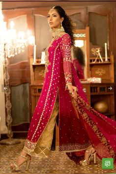 a woman in a red and gold outfit