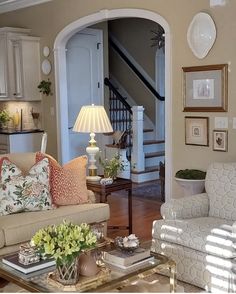 a living room filled with furniture and decor