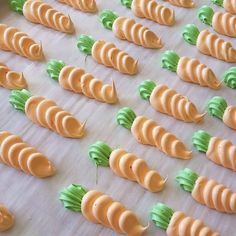 carrots are arranged in rows on a baking sheet