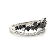 a white gold ring with black and white diamonds