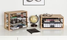 a desk with some books and other items on it, including a book shelf filled with books