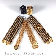 gold and black beaded necklaces, with thread spools on the side