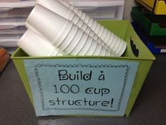 there is a green box with white cups in it that says build a 100 cup structure