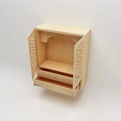 a wooden box with two compartments on the front and one drawer in the back that is open