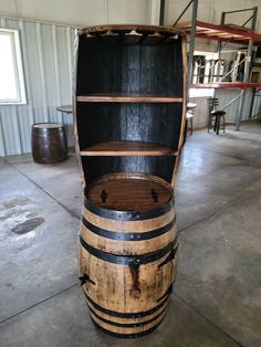 an old wooden barrel sitting inside of a building