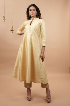 Item: 2 piece Anarkali Set for women. Dupatta is NOT included. From the Mughal-e-Azam era to the present age, Anarkali suits have enthralled us with their silhouette! Step out in style with this Ivory Anarkali and Ankle pant 2 piece set that comes in a stylish and contemporary silhouette! The color is definitely charming while the Banarasi brocade detailing around the neckline, sleeves and ankles makes it regal! This is a 2 piece set, should you need a dupatta, we have several and this set has b Traditional Full-length Kurta For Diwali, Full-length Churidar For Navratri, Anarkali Style Cream Kurta With Dabka Details, Ankle-length Fitted Kurta With Cutdana, Elegant Full-length Anarkali Set With Pallu, Elegant Full Length Salwar Kameez For Eid, Elegant Full Length Anarkali Set With Pallu, Fitted Ankle-length Kurta With Cutdana, Elegant Full-length Designer Anarkali Set