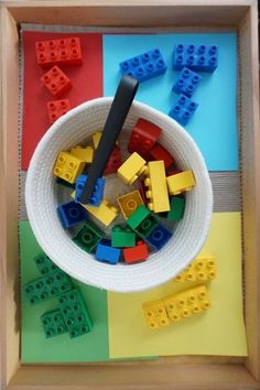 legos are in a bowl on the table