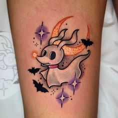 a tattoo with an image of a koala on it's thigh and stars