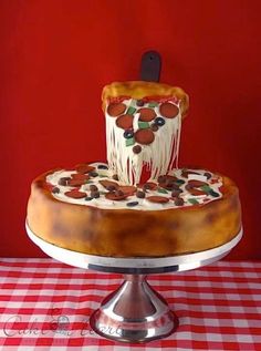 a cake that is sitting on top of a table with a red and white checkered table cloth