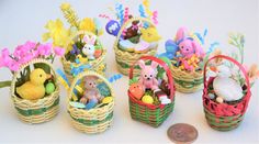 small baskets filled with toys sitting on top of a table