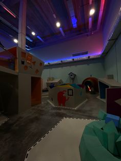 an indoor play area with toys and lights