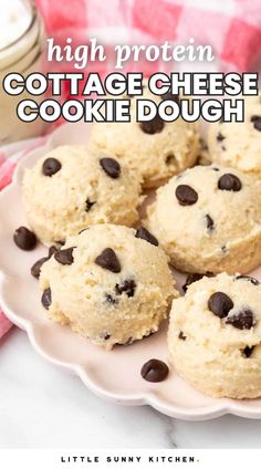 several cookies on a plate with chocolate chips in the middle and text overlay that reads high protein cottage cheese cookie dough