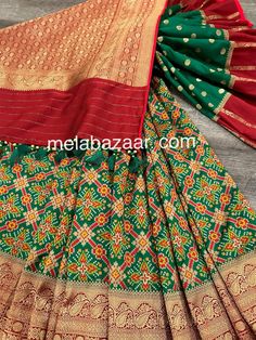 *Fine Silk Patola Saree! *Glamorous saree in green with patola weaving all throughout and Banarsi border *Matching blouse fabric included *Fall attached and designer tassels on the palla Note: The color of the products may slightly vary according to the ambient lighting conditions and the color calibration of LED devices. If you would like more clarity before your purchase, please drop us a message . Green Chanderi Pre-draped Saree For Festivals, Green Lehenga With Pallu For Festivals, Unstitched Green Lehenga With Pallu, Green Art Silk Choli With Pallu, Festive Green Choli With Pallu Detail, Festive Green Choli With Pallu, Unstitched Green Lehenga For Festivals, Transitional Green Pre-draped Saree With Self Design, Green Banarasi Silk Sets For Navratri