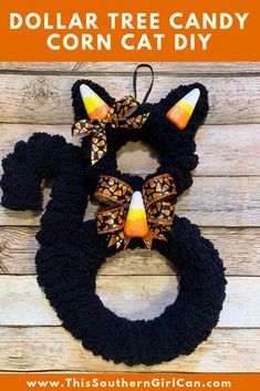 a crocheted cat wreath with the text dollar tree candy corn cat diy