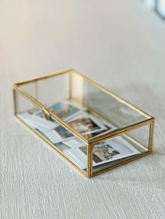 a small glass box sitting on top of a table