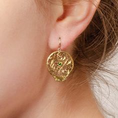 These slightly mismatched earrings were converted from antique Georgian watch cocks (circa 1780-1800) by adding 14k gold ear wires and tsavorite garnet to the gold gilt dangles. Each earring measures 1.25 inches from the top of the ear wire to bottom by 0.8 inches wide, and they are in great condition. Materials: tsavorite garnet, gold gilt, 14k. Antique Pendant Yellow Gold Earrings, Antique Yellow Gold Pendant Earrings, Vintage Gold Earrings For May Birthstone, Yellow Gold Medallion Brass Earrings, Antique Watch, Tsavorite Garnet, Antique Watches, Mismatched Earrings, Find Beauty