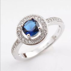 Round Blue Sapphire Center Gemstone Round Halo Setting Silver Plated Firm Price/No Trades Blue Crystal Promise Ring, Adjustable Blue Crystal Ring, Adjustable Blue Sapphire Ring, Round Halo, Halo Setting, Birthstone Ring, Womens Jewelry Rings, Sapphire Ring, Blue Sapphire