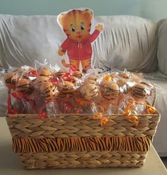 a basket filled with stuffed animals on top of a table