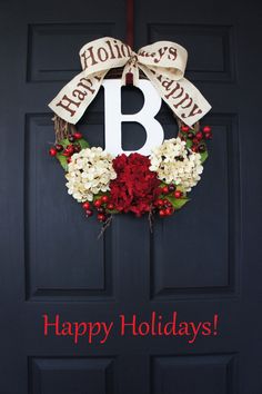 a happy holiday wreath with the letter b on it