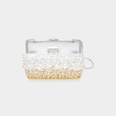 Judith Leiber Couture slim clutch bag in effervescent pattern crystals, brass, and calf leather  Detachable chain shoulder strap, 19" drop/ 40"L Framed top with lift-clasp closure  Interior, one compartment  Lining: metallic leather Approx. 5.5"H x 7"W x 1.5"D Made in Italy Luxury Gold Clutch For Cocktail, Luxury Embellished Evening Bag For Cocktail, Luxury Embellished Evening Bag For Cocktails, Luxury Evening Bag With Chain Strap For Cocktail, Luxury Cocktail Evening Bag With Chain Strap, Luxury Rectangular Clutch For Cocktail, Luxury Clutch With Chain Strap For Gala, Luxury Clutch With Chain Strap For Galas, Judith Leiber Couture