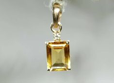 Brand : Walifine Jewellers  Material : 14k Solid Yellow Gold  Gold Weight : 0.606 Grams Gemstone : 100% Natural Citrine  Citrine Stone Weight : 1.55 Carat  Citrine Stone Size : 6×8 MM  Secondary stone : Diamond 💎  Diamond Stone Weight : 0.02 Carat  Diamond Stone Size : 1.5 MM  Gross weight : 1.6 GM Approx....  Stone Shape : Emerald Cut(Rectangular) Occasion : For Every Occasion  Benefits of Citrine:- Citrine improves Mindset, Clarity and Self-Confidence,Brings Good luck, Wealth Attractor, Promo Luxury Yellow Gold Birthstone Necklace As Gift, Citrine Pendant, Yellow Gold Necklace, Citrine Stone, Natural Citrine, November Birthstone, Jaipur Rajasthan, Diamond Stone, Gold Gold