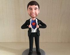 a custom bobble head figurine of a man in a suit and tie