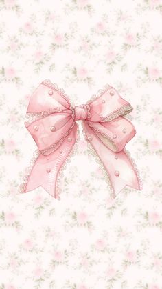 a pink bow on top of a white wallpaper with flowers and leaves in the background