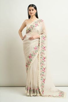 Ivory organza saree with multi colored thread work floral embroidery and scalloped borders. Comes with unstitched blouse piece. - Aza Fashions White Pre-draped Saree With Floral Embroidery, White Organza Blouse Piece With Intricate Embroidery, White Embroidered Organza Pre-draped Saree, Designer White Saree With Floral Embroidery, White Georgette Pre-draped Saree With Floral Embroidery, Designer White Pre-draped Saree With Floral Embroidery, White Floral Embroidered Chanderi Pre-draped Saree, White Pre-draped Saree With Floral Embroidery For Festivals, Festive White Pre-draped Saree With Floral Embroidery