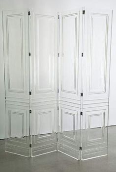 a room divider with four doors in it