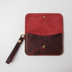 The wristlet clutch is our most versatile leather clutch, with plenty of space for your cards, keys, and phone. It's made of the same beautiful full-grain leathers as our bestselling leather tote bags and can be embossed with your initials at no additional charge. It measures 8.5 inches by 5.25 inches, with a 5.5-inch wristlet strap. Luxury Pouch With Interior Card Slots For Everyday Use, Daily Use Clutch With Interior Card Slots, Leather Pouch With Interior Card Slots For Everyday Use, Everyday Clutch Pouch With Interior Card Slots, Everyday Clutch With Interior Card Slots, Leather Pouch With Card Slots For Everyday Use, Rectangular Wristlet With Card Slots For Everyday Use, Rectangular Wristlet With Interior Card Slots For Everyday Use, Everyday Rectangular Wristlet With Card Slots