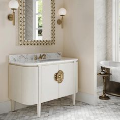 a bathroom with a sink, mirror and bathtub