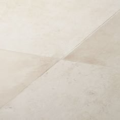 a skateboard is laying on the ground in front of a white tiled flooring