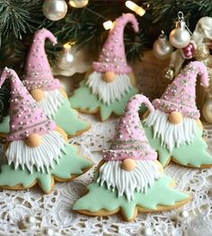 decorated cookies are sitting on a doily