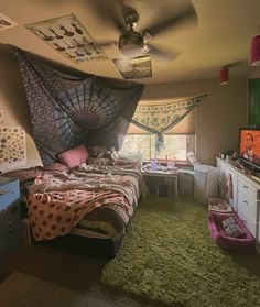 a bed room with a neatly made bed and green carpeted flooring next to a window