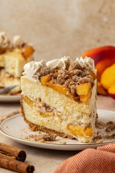 a slice of cake on a plate with cinnamon and peaches in the back ground