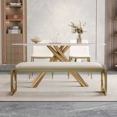 a dining room table with two chairs and a bench in front of it on carpeted flooring