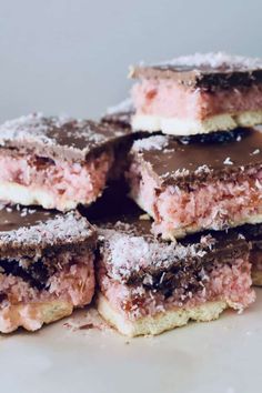 a pile of desserts sitting on top of a white plate