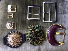 Here are a lot of 8 Belt Buckles for belt makers or seamstresses. Described beginning with the top left buckle and going clockwise. 1.Ralph Lauren polished gold-tone buckle marked RLL.  For a belt of 9/16" high. The buckle width- ¾" 2.Polished silver-tone buckle marked NY&Co. For a 2" high belt. The buckle width- 2" 3.Polished silver-tone buckle for a belt of 3/18" high. The buckle width-2 ¼". 4.Polished gold tone filled with maroon lacquer buckle for a belt of 2" high. The buckle width-3". 5.Mo Luxury Designer Belt Buckles With Brass Buckle, Luxury Traditional Belt Buckles With Antique Buckle, Luxury Belts With Brass Buckle, Luxury Brown Antique Belt Buckles, Luxury Vintage Brass Belt Buckle, Designer Belt, Suede Belt, Gold Dragon, Vintage Belt Buckles