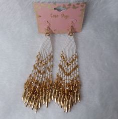 Multi-Dangle Pierce Earrings In Gold And White Beads By Coco Skye. The Back Of Card States Made In India, The Card May Be Made In China. New Without Tags. Did Not Removed From Card For Pictures. Measurements 5 Inches At Longest Point By 1 1/2 Inches At Widest Without The Dangle. Measurements Done Laying Down Are Estimated. # Ak- 5 Earrings In Gold, Beaded Dangles, White Beads, Earrings Gold, Seed Bead, Beaded Earrings, Seed Beads, Made In China, Gold Earrings