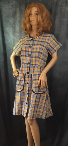 Blue Tartan Plaid Button Down Shirtwaist Dress Mid Century Vintage  Blue & Yellow Orange Tartan Plaid Pattern 2 Front Pockets  8 Large Blue Plastic Texturized Front Buttons Previously hemmed, extra button on hem Mid Century Vintage Estimated Era 1950's  Pre owned-Great Condition Missing matching belt Vintage Plaid Workwear Dress, Plaid Cotton Vintage Dress, 1950s Plaid Summer Dresses, Vintage Short Sleeve Plaid Cotton Dress, Vintage Plaid Dress With Button Closure, Miss Match, Blue Yellow Orange, Blue Tartan, Shirtwaist Dress