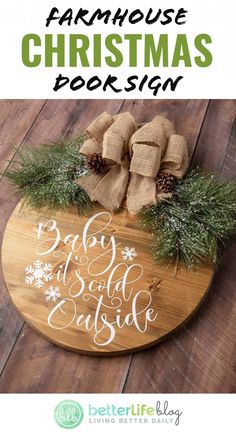 the farmhouse christmas sign is made from wood and has snowflakes on it, with evergreen