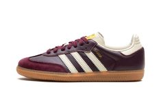 The Women’s adidas Samba OG “Maroon/Cream White” is a women’s-exclusive colorway of the classic indoor soccer shoe with a maroon-based appearance.  The upper features a maroon leather base with a tonal suede overlay on the toe.  Cream White Three Stripes branding appears on both sides, while a gold “Samba” logo can be found on the lateral side of the midfoot.  Gold adidas branding appears on the Cream White tongue.  Underfoot, a gum rubber sole rounds out the look. Adidas Shoes Samba, Nike X Travis Scott, Gold Adidas, Adidas Samba Og, Samba Og, Maroon Leather, Adidas Brand, Baskets Adidas, Mens Uggs