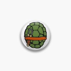 a button with an image of a tortoise wearing a chain around its neck