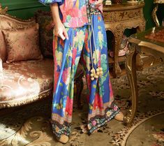 Embrace the effortless charm of these feminine pants, where comfort meets a burst of floral elegance. These pants feature a captivating floral print, enhanced by a contrast border print at the waistband and hem, making every day feel like a stroll through a blooming garden. From Aratta. Floral Print Wide-leg Loungewear Pants, Floral Print Loungewear Ankle-length Pants, Bohemian Floral Print Pants For Loungewear, Feminine Pants, Blooming Garden, Border Print, Feel Like, Royal Blue, Every Day