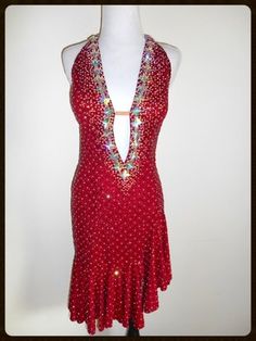 a woman's red dress with sequins on it