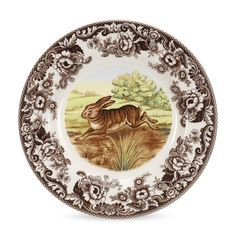 a brown and white plate with an image of a rabbit on it's side