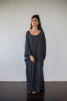 This Organic Cotton Kimono Dress is of a jersey Cotton like no other. Enjoy the lushness of this gorgeously full One Size Kimono Sleeve Maxi Dress. This fabric and design provide the elegance and ease of feeling like a Queen in my own house or taking it out, with any style I choose to accessorize it with. Wear it loose for a minimalist oversized look (enjoy the pockets!) or cinch it at the waist to find your own shape. The charcoal grey fabric is ever so forgiving for all manners of issues- (stains, versatility of events to wear at)- the options are endless!  The options are endless!  Model is 5 feet 7 120 lbs This does not necessarily mean however that the dress will be long on you if you are shorter, as it may 'lift' if you are curvier :) But do not hesitate to contact me for any sizing Cotton Crew Neck Sleep Dress, Black Cotton Sleep Dress, Kimono Sleeve Dress, Charcoal Dress, Grey Tshirt, Cotton Kimono, Organic Cotton Fabric, Kimono Dress, Kimono Sleeve