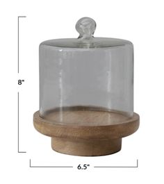 a wooden base with a glass dome on it's top and a wood base