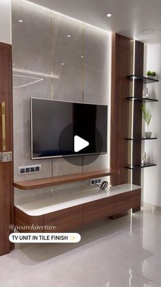 a flat screen tv sitting on top of a wooden entertainment center in a living room